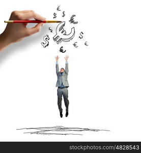 Aspiration to wealth. Young businessman jumping to catch euro symbols. Currency concept