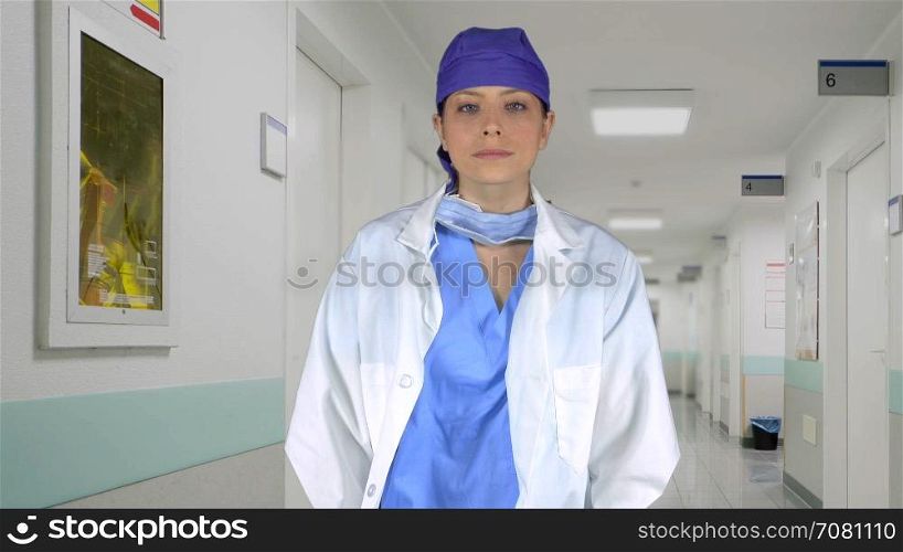 Assertive medical professional crosses her arms in a hospital