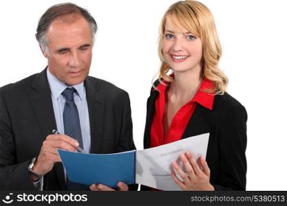 Assistant proudly showing her work to boss