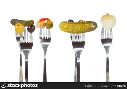 Assorted appetizers pricked on a fork
