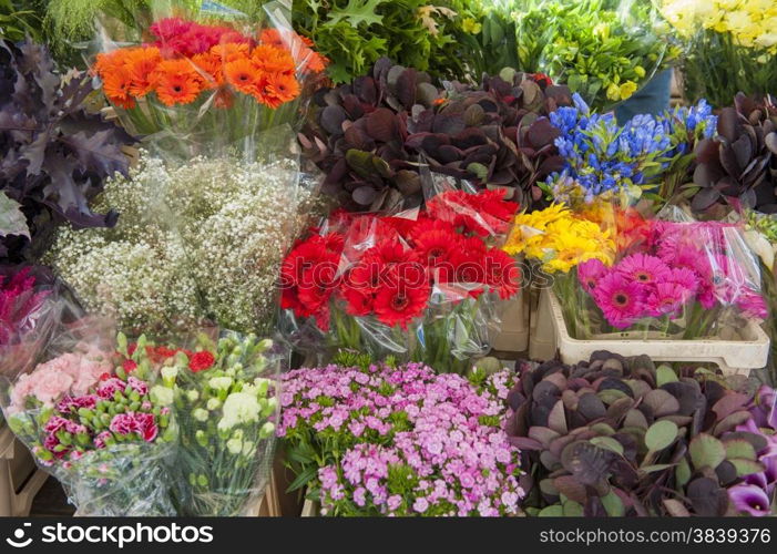 Assorted arrangement of cut flowers in a market stall