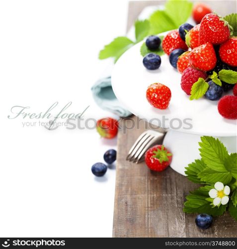 Assorted berries on a plate (with easy removable sample text)