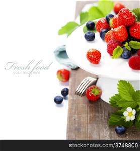 Assorted berries on a plate (with easy removable sample text)