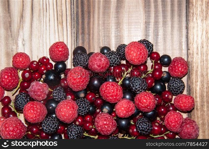 Assorted Berry on the old wooden table