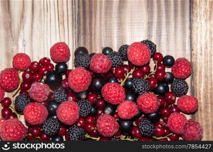 Assorted Berry on the old wooden table
