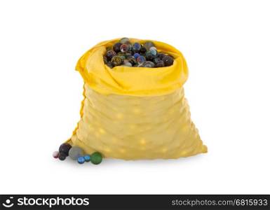 Assorted black glass marbles arranged in a yellow pouch, over a white background