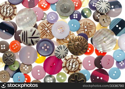 Assorted buttons as colorful background. Sewing accessories.