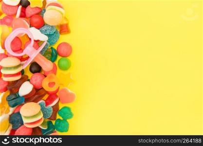 assorted candies on a pastel colored background