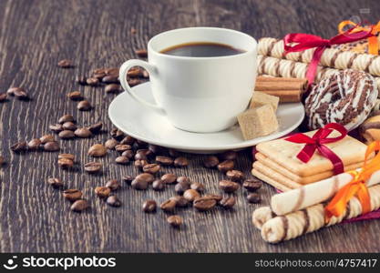 Assorted cookies and cup of coffee. Assorted cookies on table and white cup of coffee