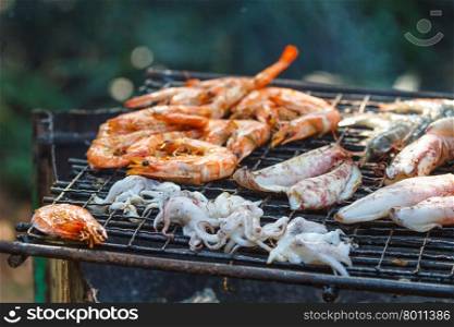 Assorted delicious grilled meat&#xA;over the coals on a barbecue