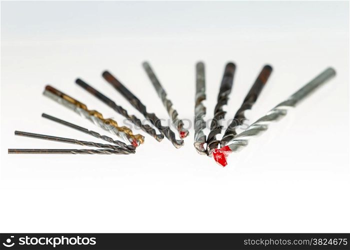 Assorted drill bits on isolated white background