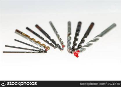 Assorted drill bits on isolated white background