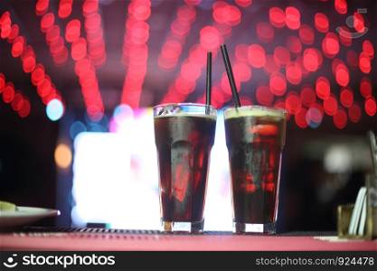 Assorted drinks of orange fernet lemon in the pub with the backlights