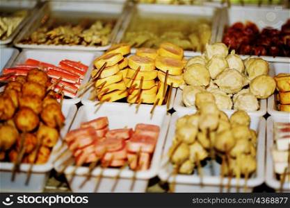 Assorted food on skewers at market stall, Nanjing, Jiangsu Province, China