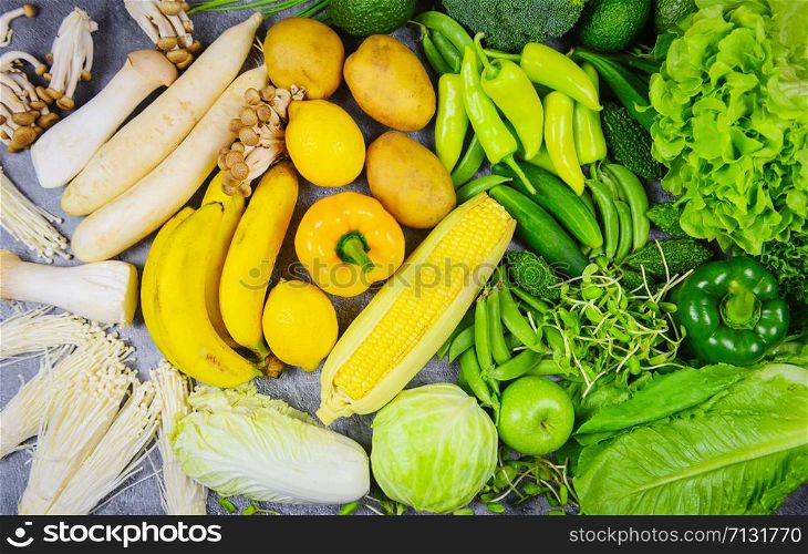 Assorted fresh ripe fruit yellow white and green vegetables mixed selection various mushrooms , top view / vegetables and fruits background healthy food clean eating for heart life cholesterol health