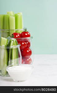 assorted fresh vegetables with dip on blue background - Vegan, Vegetarian, Healthy food