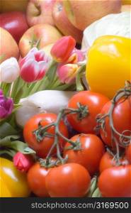 Assorted Fruits And Vegetables With Multicolored Tulips
