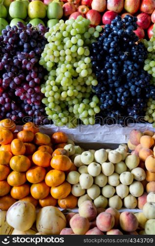 Assorted fruits at market stall in Mercado Central, Cuzco, Peru