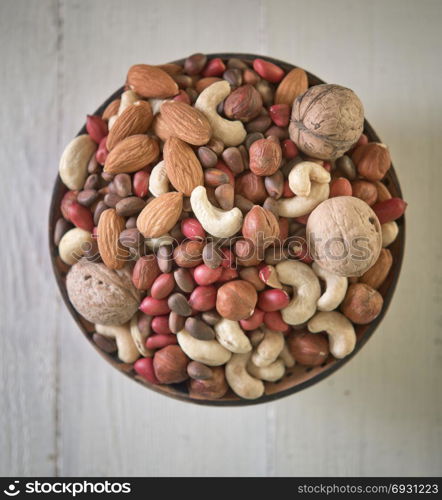Assorted nuts in wooden bowl