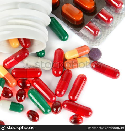 Assorted pharmaceutical medicine pills, tablets and capsules isolated on white background. Flat lay, top view.
