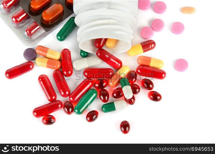 Assorted pharmaceutical medicine pills, tablets and capsules isolated on white background. Flat lay, top view. Free space for text.