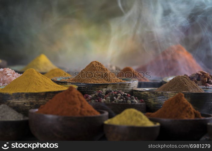 Assorted Spices and wooden bowl of smoke