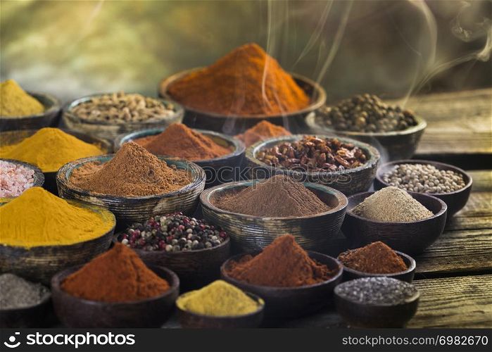 Assorted Spices and wooden bowl of smoke