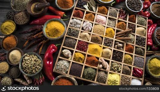 Assorted Spices in a wooden box. Close-up of different types of Assorted Spices in a wooden box