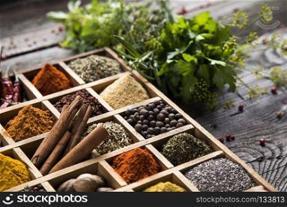 Assorted Spices in a wooden box. Close-up of different types of Assorted Spices in a wooden box
