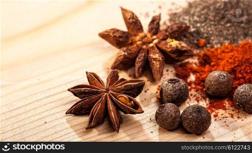 Assorted spices over wooden desk, food backgrounds