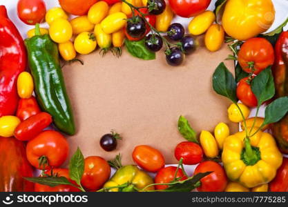 Assorted tomatoes and vegetables isolated on white background. Photo for your design