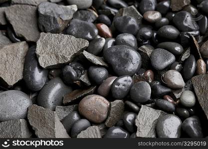 Assorted wet round and angular pebbles