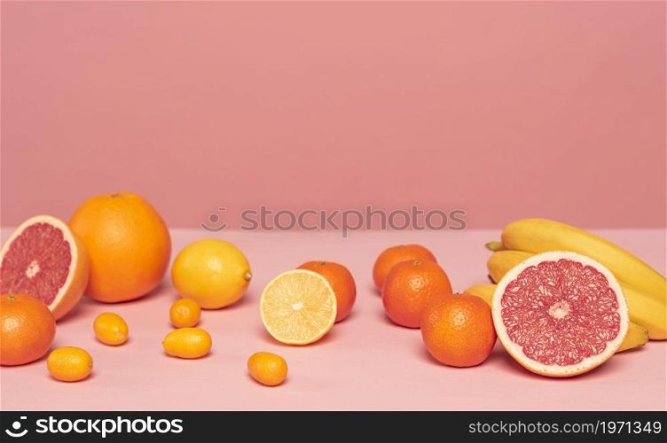 assortment citruses pink table. High resolution photo. assortment citruses pink table. High quality photo