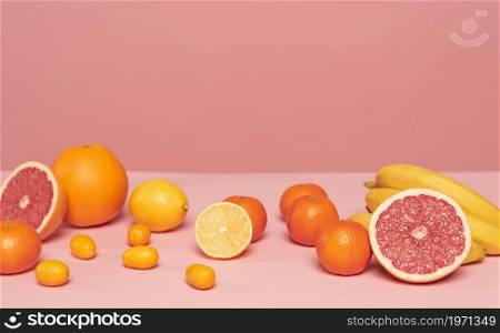 assortment citruses pink table. High resolution photo. assortment citruses pink table. High quality photo