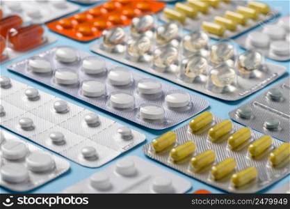 Assortment different new pharmacy pills and drugs in blisters closeup