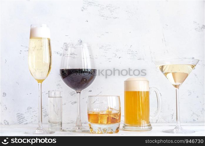 Assortment of alcoholic drinks on white background