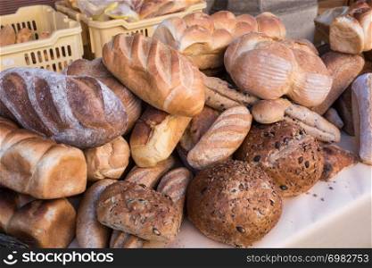 Assortment of bread in the shop. Different fresh bread on market.