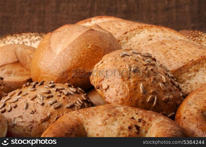 Assortment of breads still life on rustic background