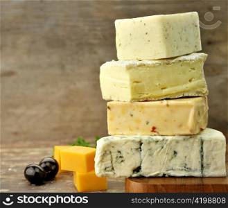 Assortment of Cheese On A Cutting Board