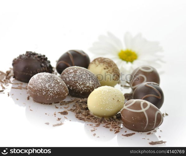 assortment of chocolate eggs on white background