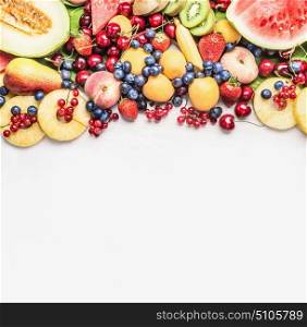 Assortment of colorful summer fruits for Healthy eating and cooking , white wooden background, top view, border