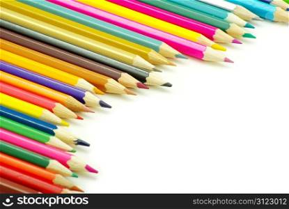 Assortment of coloured pencils on white background