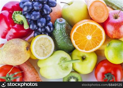 Assortment of exotic fruits and vegetables on white background