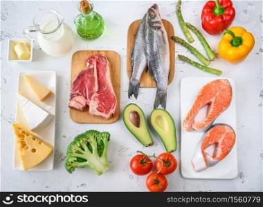 Assortment of food for ketogenic diet on wooden background