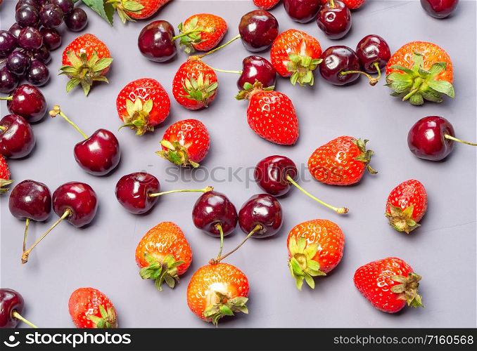 Assortment of fresh berries. strawberries and cherries. Top view.. Mixed fruits and berries. Strawberries and cherries.