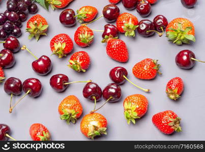 Assortment of fresh berries. strawberries and cherries. Top view.. Mixed fruits and berries. Strawberries and cherries.