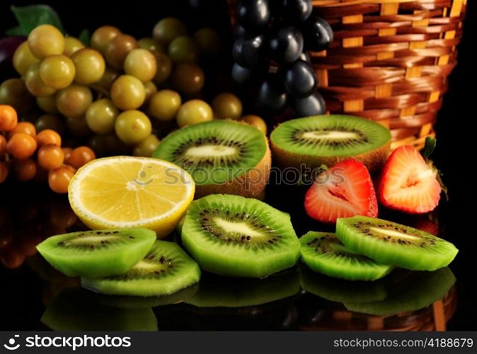 assortment of fresh fruits on black background