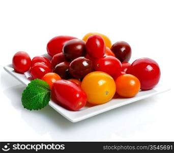 Assortment Of Fresh Small Tomatoes In A White Dish
