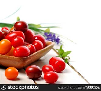 Assortment Of Fresh Small Tomatoes On White Background