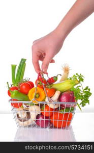 Assortment of fresh vegetables in metal basket